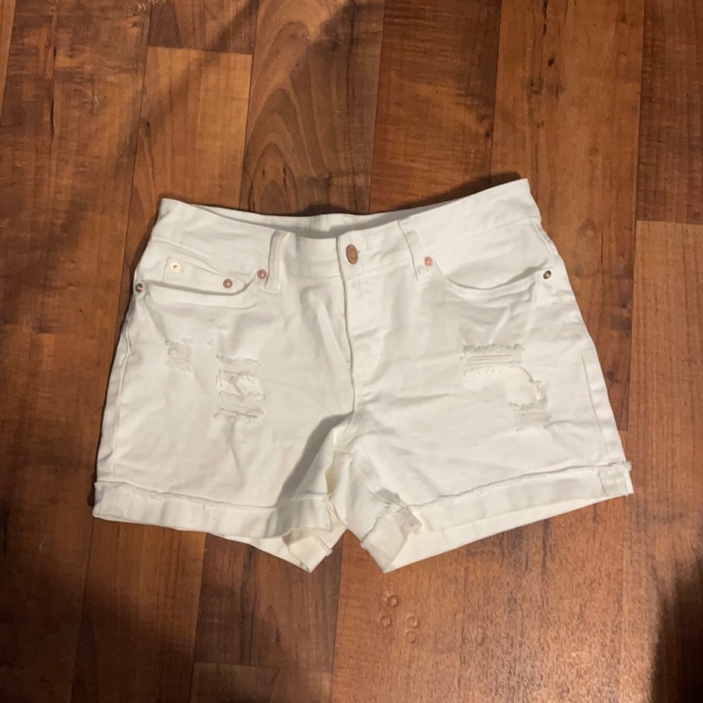 White ripped shorts